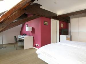 Letto o letti in una camera di Auberge de Prangins