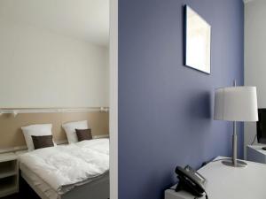 Letto o letti in una camera di Auberge de Prangins