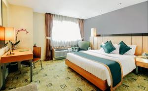 Postel nebo postele na pokoji v ubytování Greenhills Elan Hotel Modern - Newly Renovated