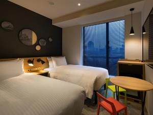 Postel nebo postele na pokoji v ubytování Granbell Hotel Osaka