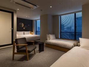Postel nebo postele na pokoji v ubytování Granbell Hotel Osaka