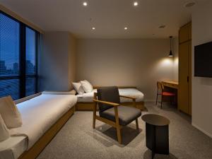Postel nebo postele na pokoji v ubytování Granbell Hotel Osaka