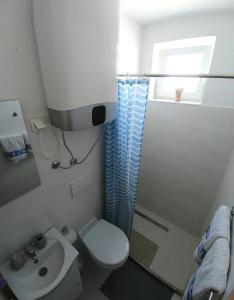 Koupelna v ubytování Apartmani Valuna