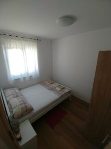 Postel nebo postele na pokoji v ubytování Apartmani Valuna