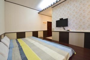 TV a/nebo společenská místnost v ubytování Luyi Ludao B&B