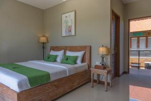 Postel nebo postele na pokoji v ubytování Alam Kawi Ubud Resort & Spa