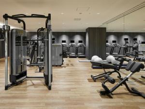 a gym with several rows of exercise bikes and weights at THE THOUSAND KYOTO in Kyoto