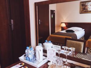 Łóżko lub łóżka w pokoju w obiekcie Hotel Osjann