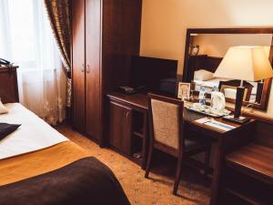 Łóżko lub łóżka w pokoju w obiekcie Hotel Osjann