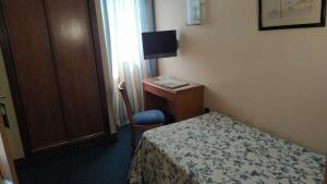 A bed or beds in a room at Hotel Ébora by Vivere Stays