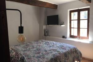 Krevet ili kreveti u jedinici u okviru objekta Maison Drome provençale vue imprenable