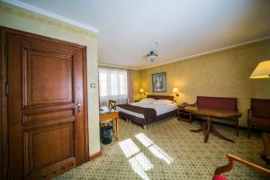 Postel nebo postele na pokoji v ubytování Hotel Opera