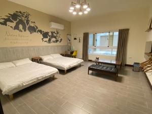 Voodi või voodid majutusasutuse 澎湖紙飛機民宿Paper Jet B&B toas