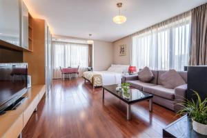 Posezení v ubytování Qingdao Housing International Hotel