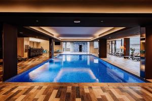 a large swimming pool in a house at Brezovica Hotel & SPA in Brezovica