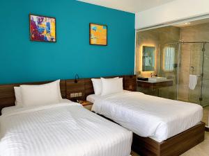 Postel nebo postele na pokoji v ubytování CHAU KHUONG HOTEL
