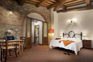 A bed or beds in a room at Agriturismo Le Macie