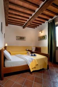 A bed or beds in a room at Agriturismo Le Macie Még 24 kép