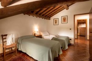 A bed or beds in a room at Agriturismo Le Macie