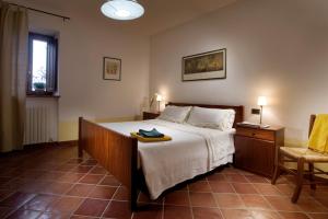 A bed or beds in a room at Agriturismo Le Macie