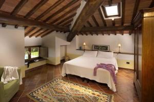 A bed or beds in a room at Agriturismo Le Macie
