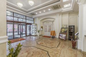 a large room with a lobby with a large window at Degas Voronezh Center in Voronezh
