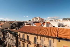 a view of a city with buildings and roofs at The rest between Picasso & Pompidou in Málaga