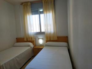 Postel nebo postele na pokoji v ubytování Pompeya Vista Mar Orangecosta