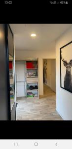 a room with a painting of a deer on the wall at Belle vue D'Olhain in Fresnicourt-le-Dolmen