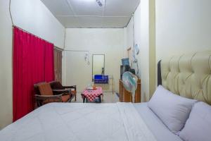 Postel nebo postele na pokoji v ubytování Hotel Jogja Bukittinggi + 37 fotografií