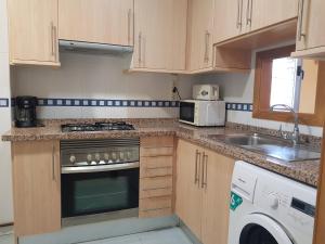 Kuchyň nebo kuchyňský kout v ubytování Paraiso Lido-Fincas Benidorm