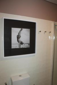 a picture of a man in the shower in a bathroom at CASA DAS QUATRO CABEÇAS in Setúbal +60 photos