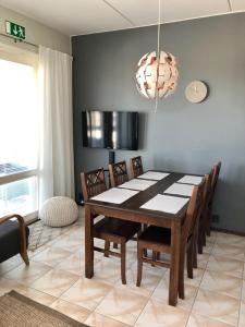 a dining room with a table and chairs at Seastar 101 in Kalajoki