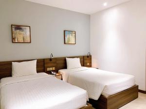 Postel nebo postele na pokoji v ubytování CHAU KHUONG HOTEL