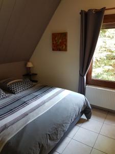 Un pat sau paturi într-o cameră la La Griotte & Spa&Piscine