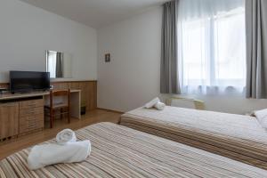 Postel nebo postele na pokoji v ubytování Hotel Porto