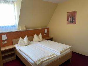 Кровать или кровати в номере "Blauer Bock" - Hotel-Garni