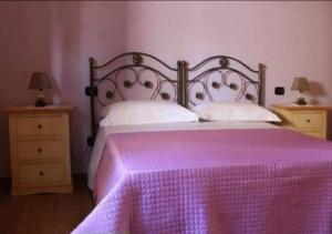 Postel nebo postele na pokoji v ubytování B&B Il Casolare