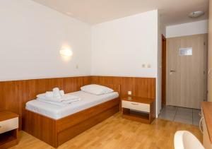 Postel nebo postele na pokoji v ubytování Hotel Porto