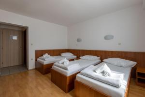 Postel nebo postele na pokoji v ubytování Hotel Porto