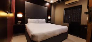 Tempat tidur dalam kamar di Leisure Stays - Premium Suites