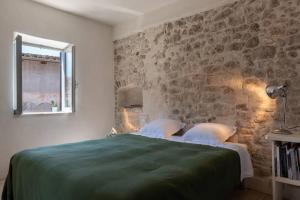 Postel nebo postele na pokoji v ubytování La Casa della bifora / The House of the mullion
