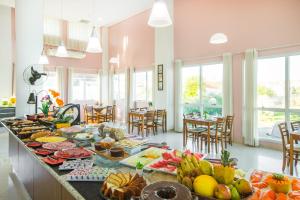 a buffet of food on a table in a kitchen at Oceania Park Hotel Spa & Convention by RB Hotelaria in Florianópolis