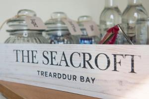 a sign that reads the seafront meridian bay at Seacroft in Holyhead