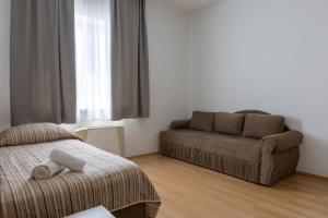 Postel nebo postele na pokoji v ubytování Hotel Porto