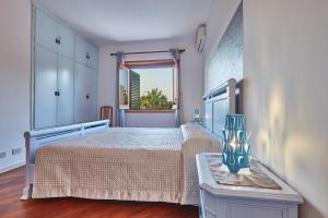 A bed or beds in a room at Villa Morenanoemi - private pool