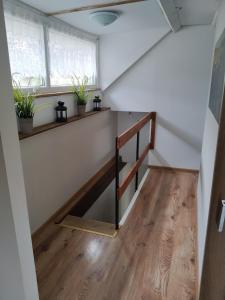 a stairwell in a tiny house with plants on it at Willa Słowianka in Polanica-Zdrój