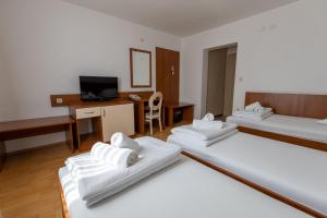 Postel nebo postele na pokoji v ubytování Hotel Porto