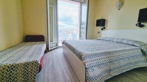 Postel nebo postele na pokoji v ubytování Residence Rosa