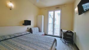 Postel nebo postele na pokoji v ubytování Residence Rosa